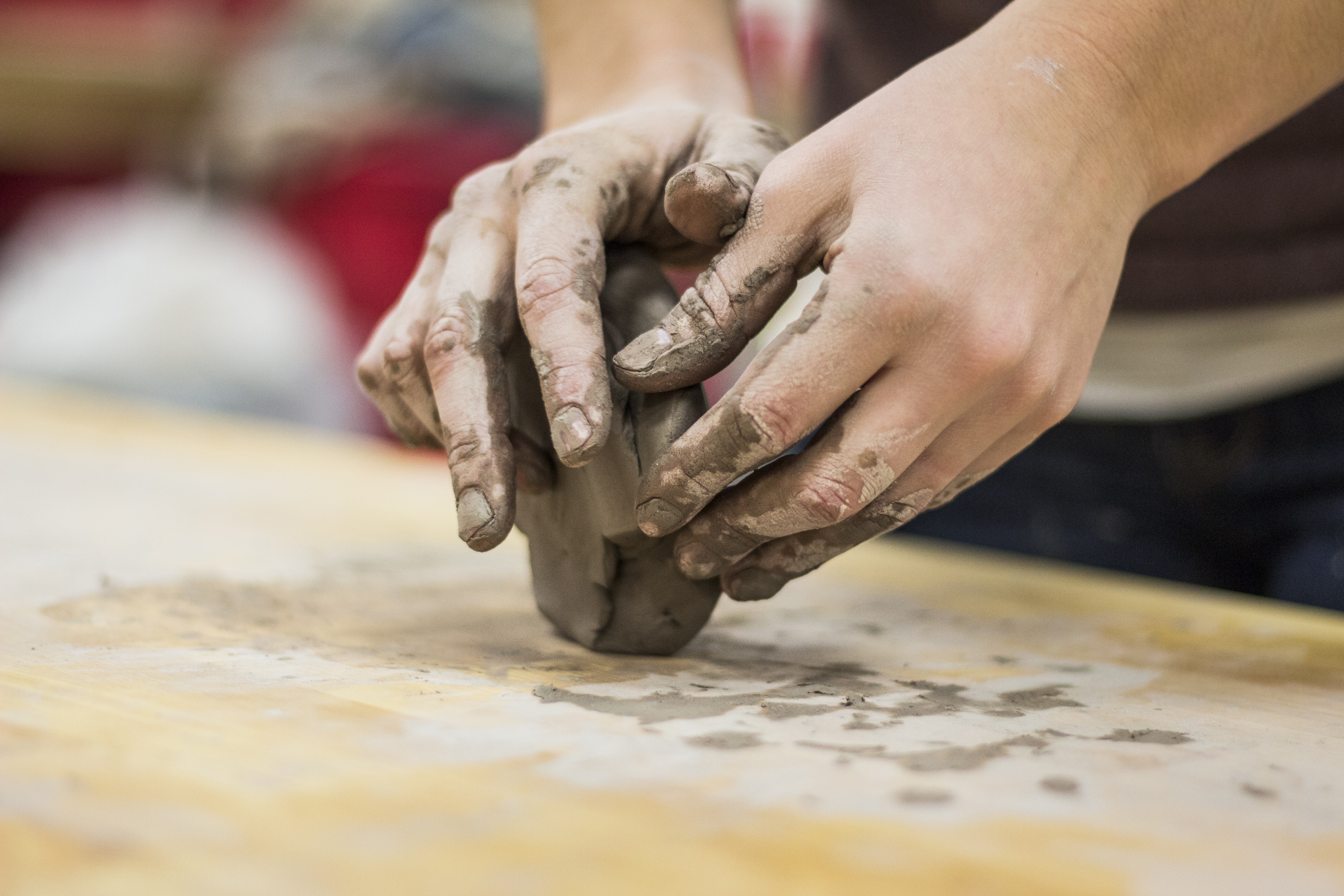 Hands moulding clay