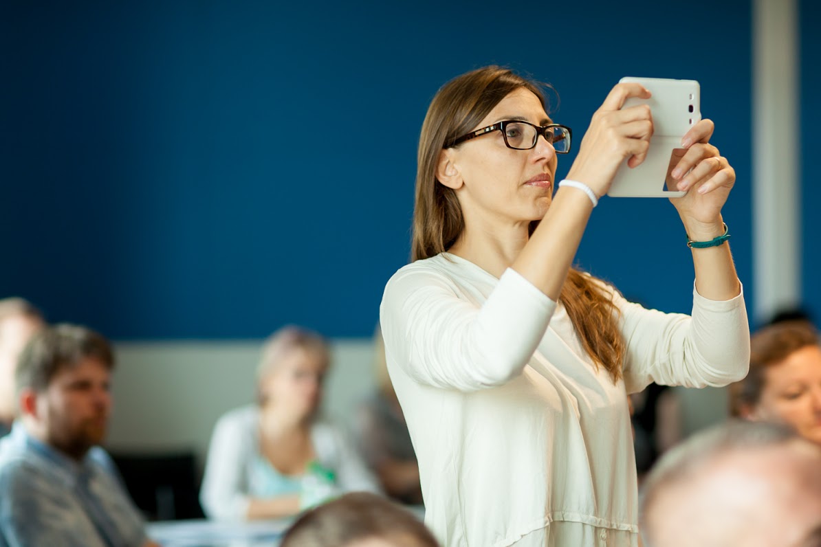 Woman taking photo with smartphone