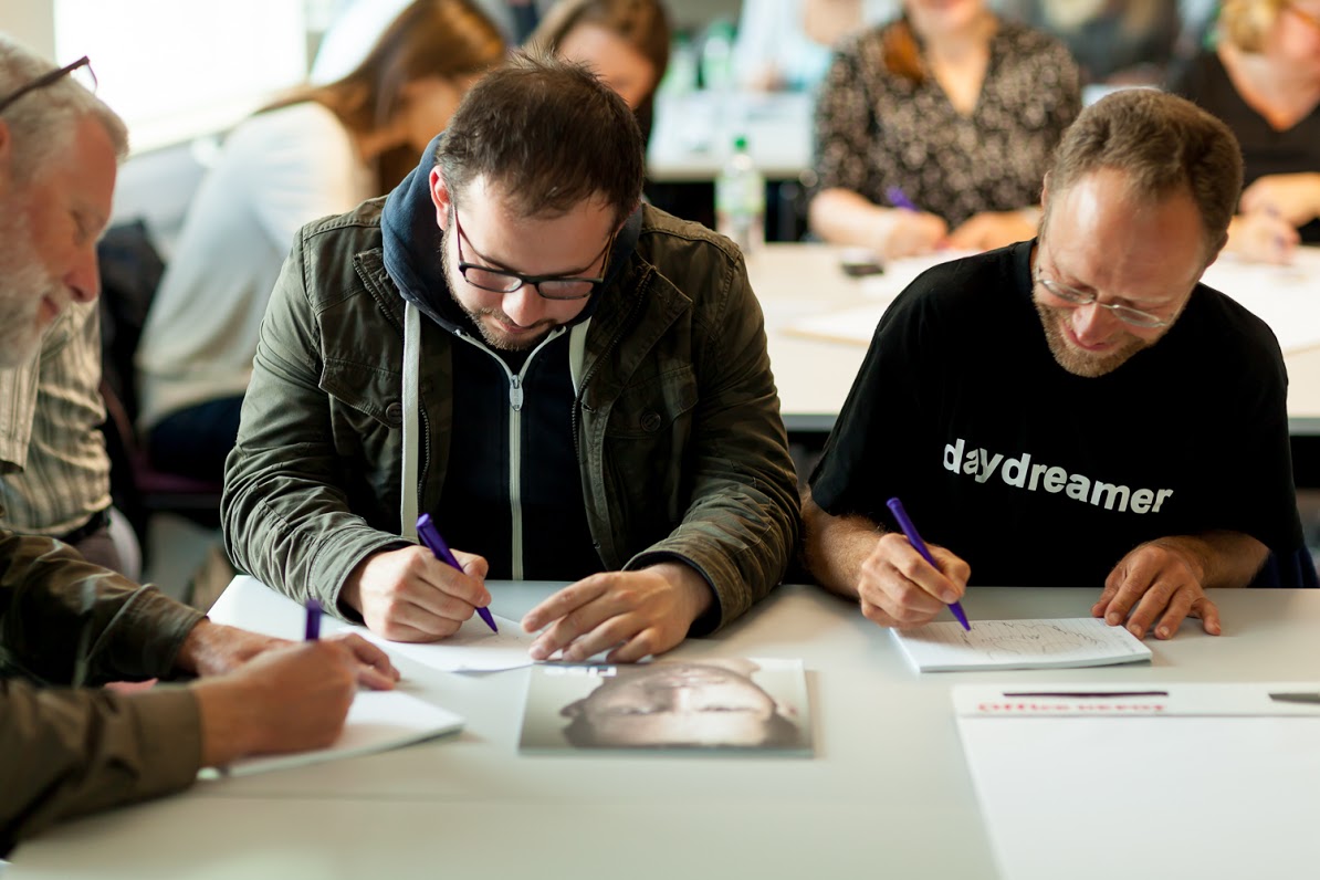 Partners writing in workshop