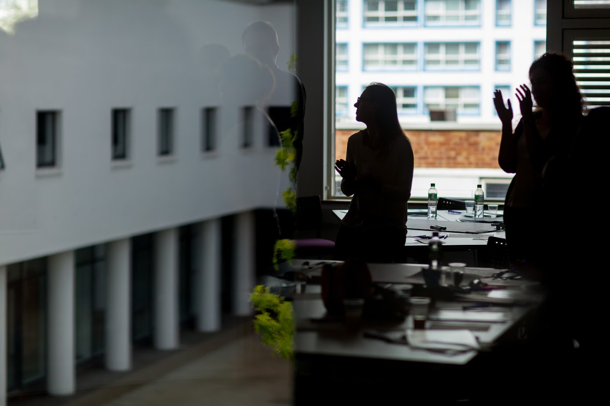 Silhouette of partner applauding