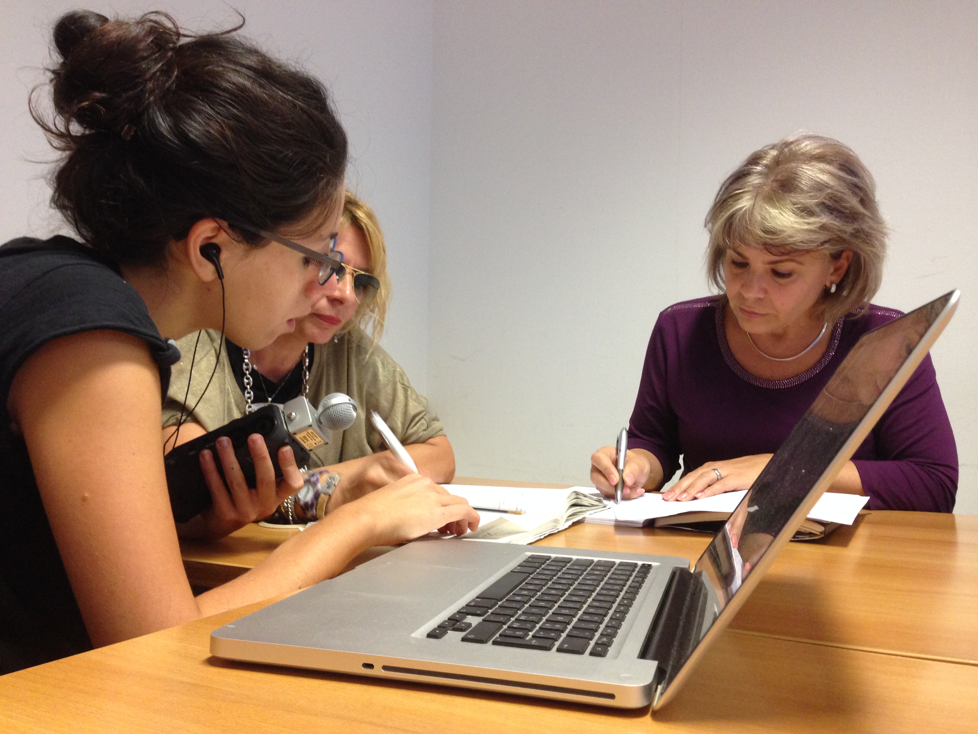 Partners working next to laptop