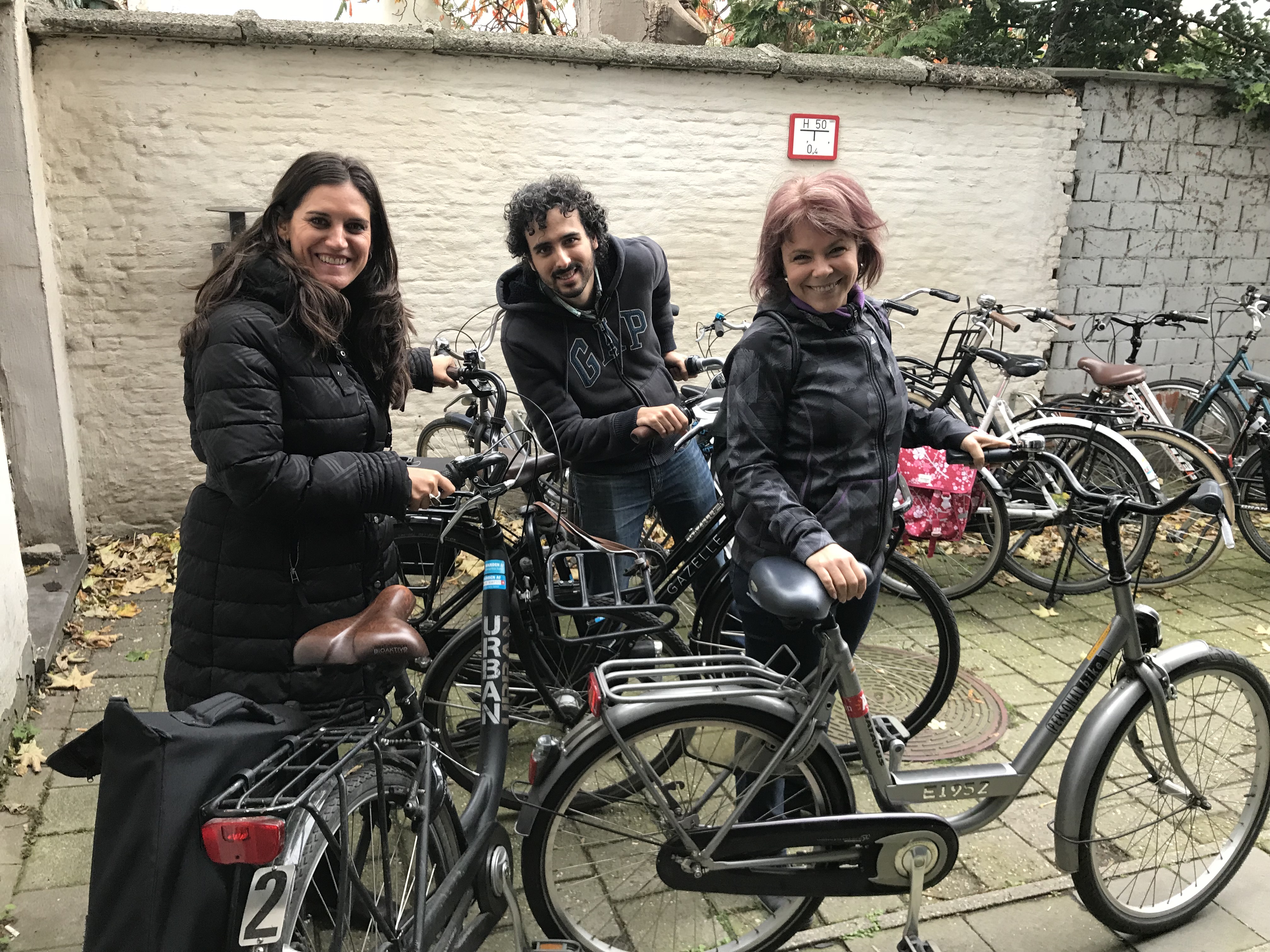 Partners posing next to bikes on biking trip