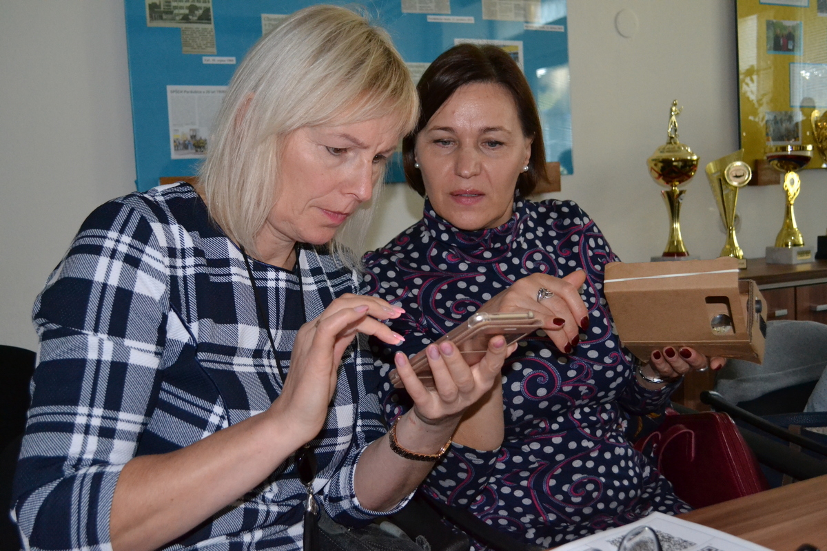 Two women using their smartphones