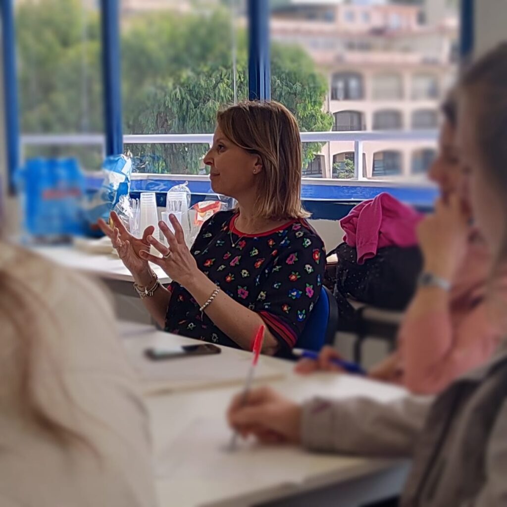 Woman speaking to rest of class