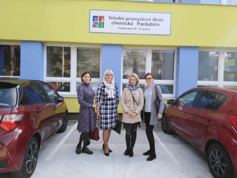 Teachers posing in front of a vocational chemistry school, part of a previous mobility project that combined training with real-world learning experiences.