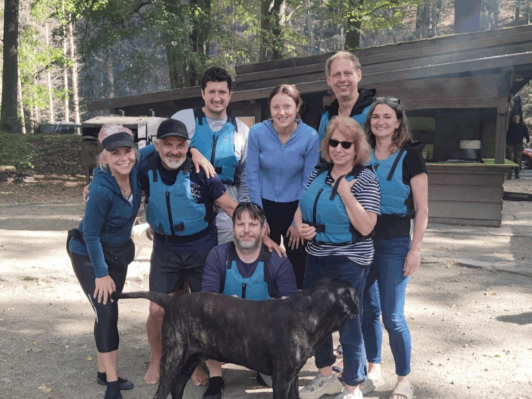 Participants enjoying a rafting trip along the Vltava River on the way to Český Krumlov — a perfect mix of teamwork and adventure.